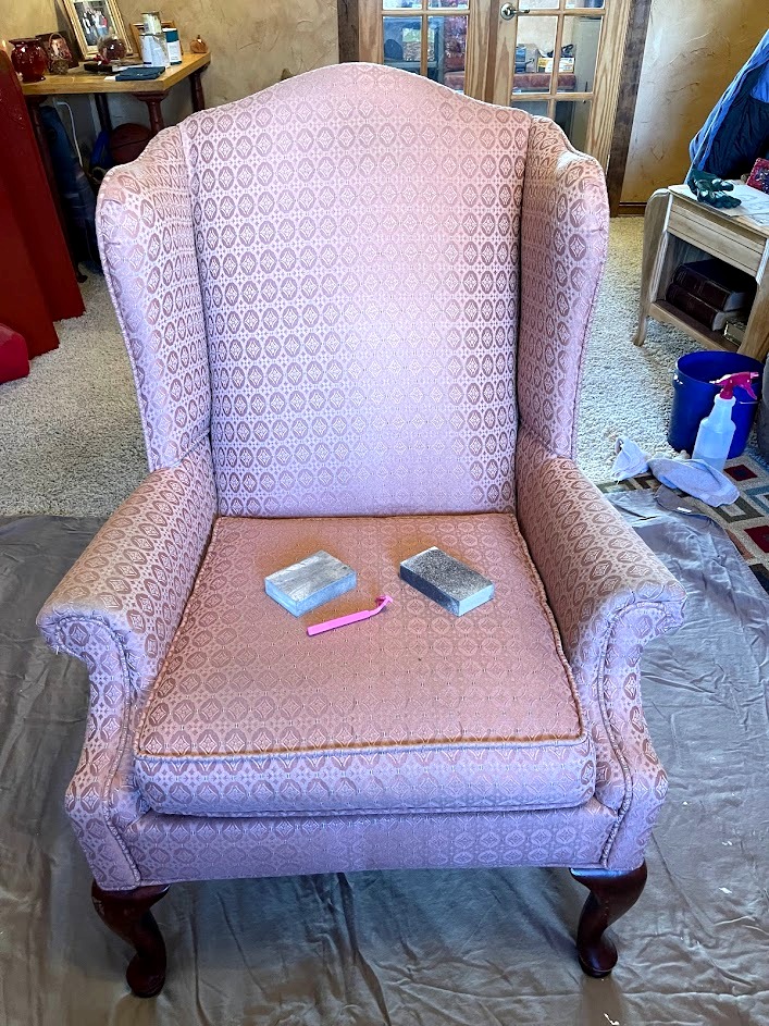 Woman Paints Leather Chair as a Test Before Painting a Couch